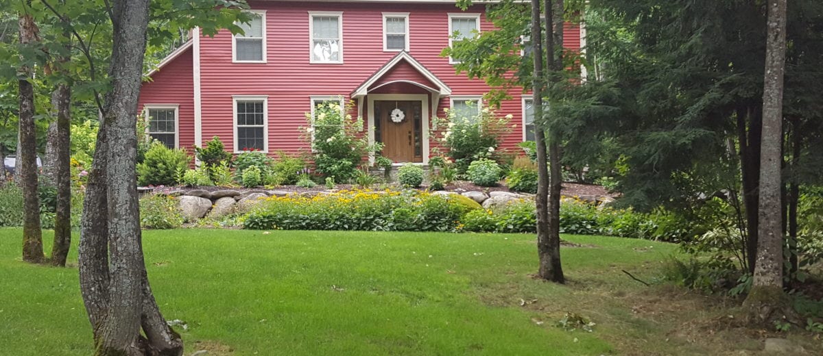 exterior photo of home with a landscaped garden