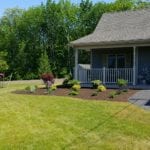 exterior photo of garden landscaping in front of home