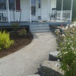 exterior photo of stone steps and garden landscaping