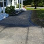 exterior photo of stone walkway leading to porch